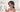 Cartoon character noticing dark spots and uneven skin tone in a mirror